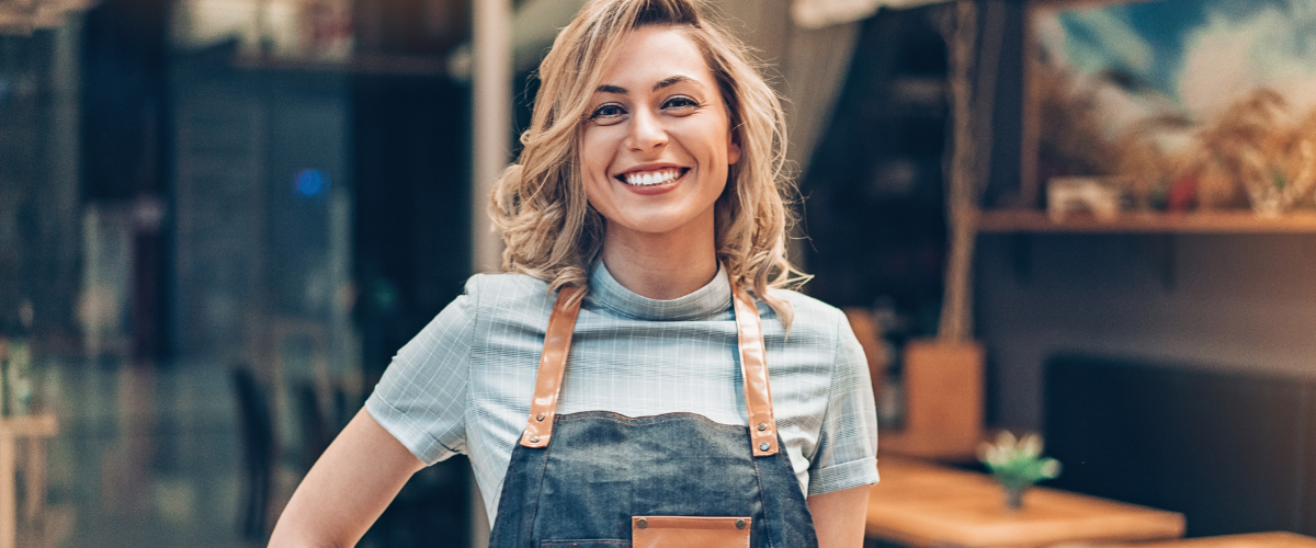 first time small business woman in front of business