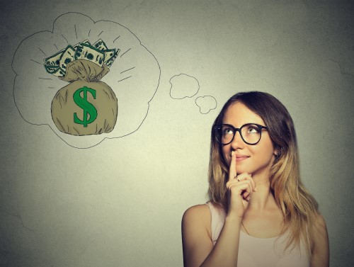 Woman with a thought bubble which contains money bag.