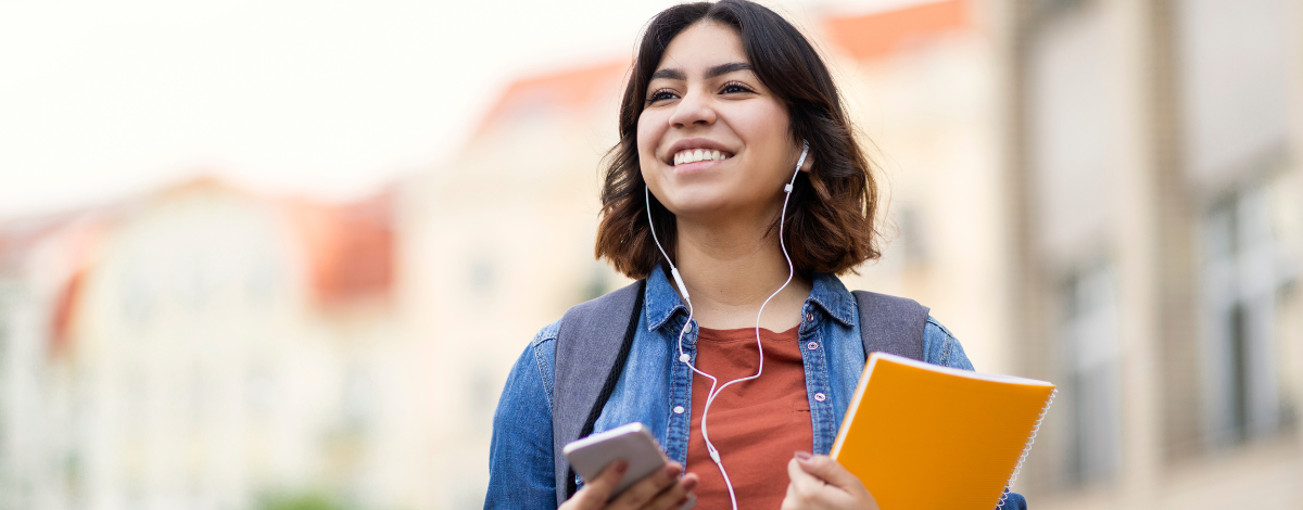 student with folder and phone