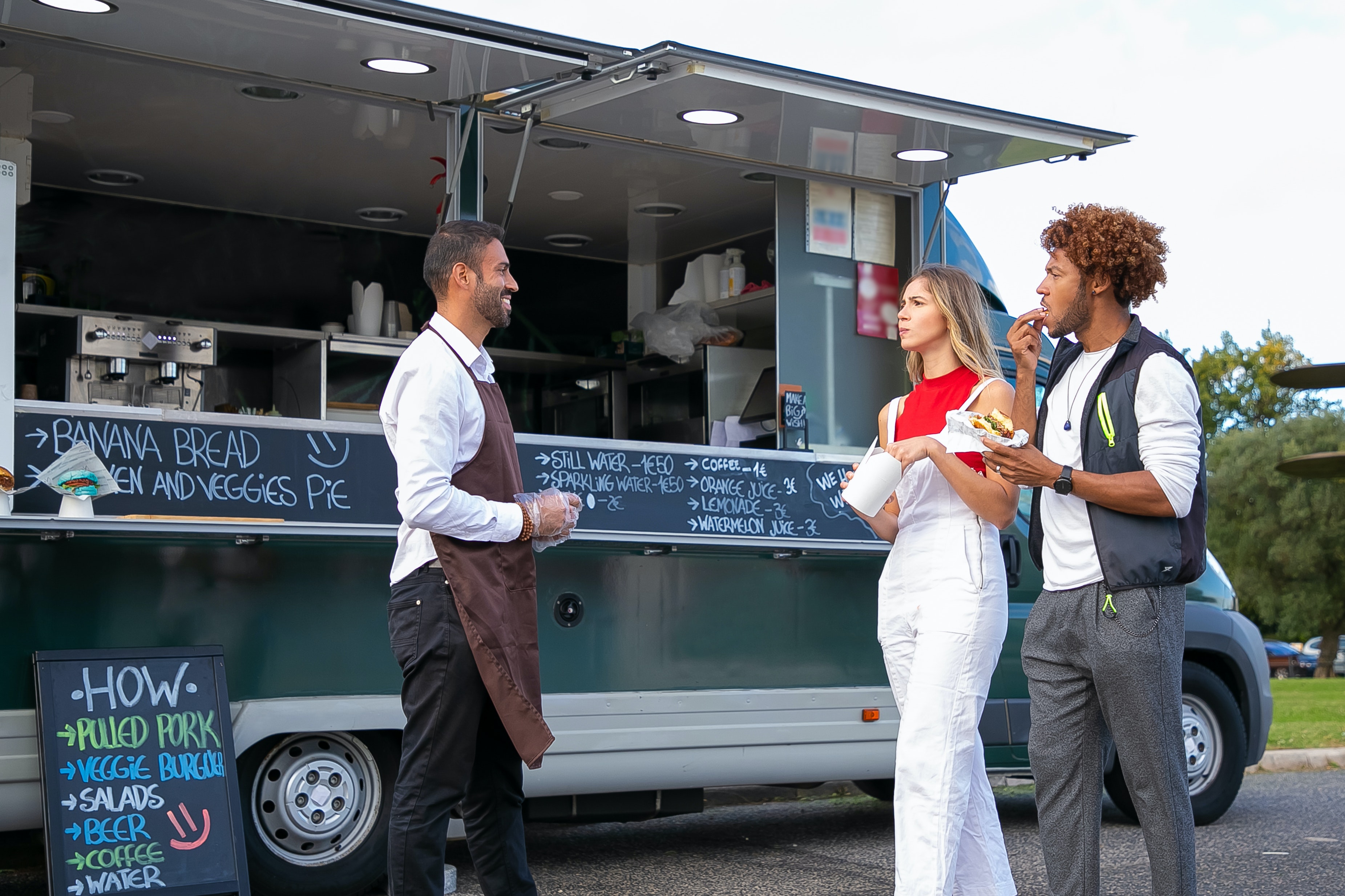man and customers outside of a small business food truck
