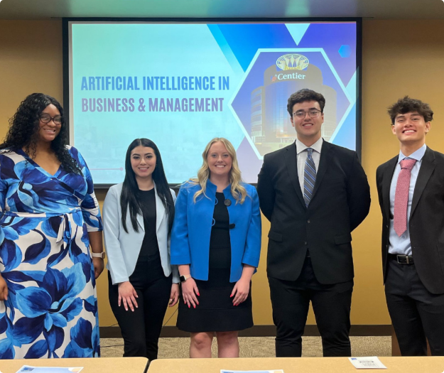 Interns in front of presentation