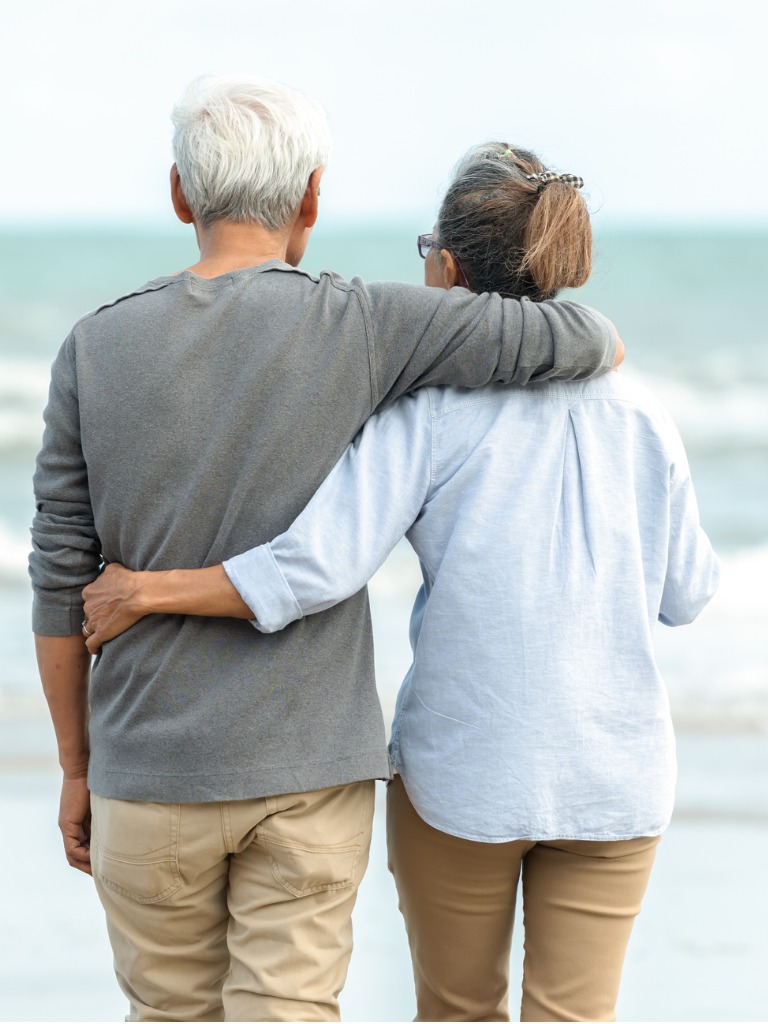 Senior couple looking at ocean